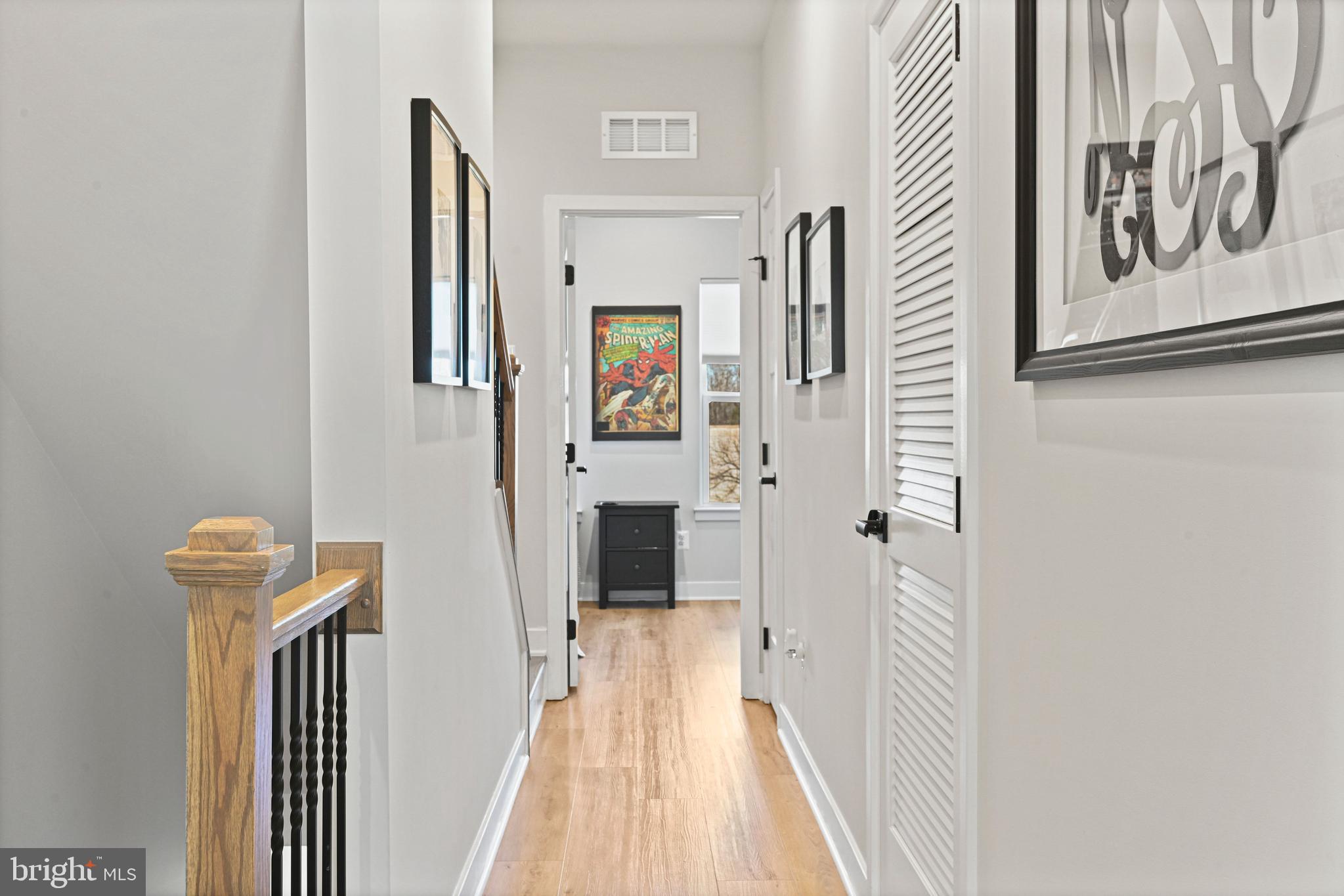 14008 Airfoil Road Herndon, VA 20171 - Photo 21 of 47 a view of a hallway with wooden floor and staircase