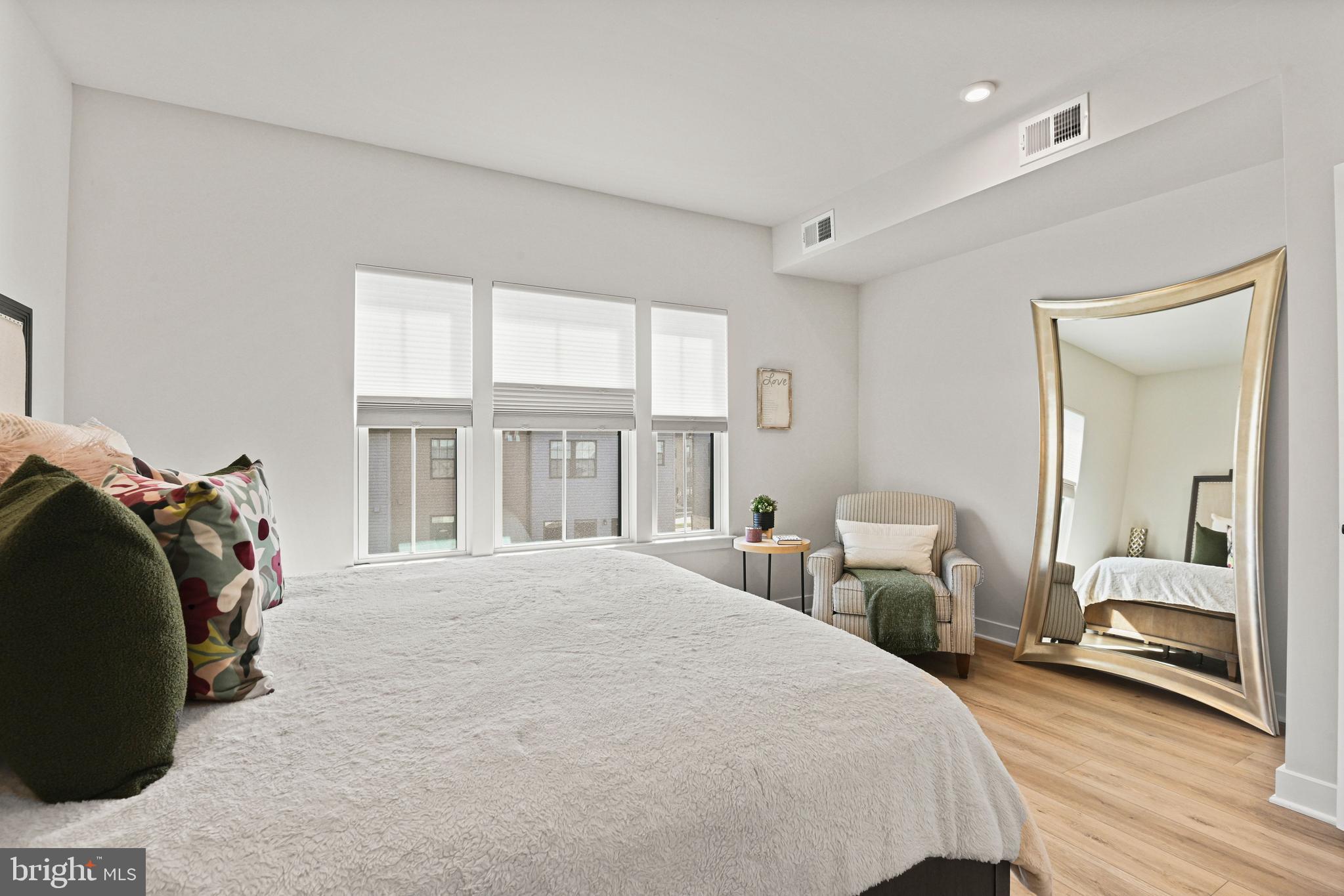 14008 Airfoil Road Herndon, VA 20171 - Photo 24 of 47 a bedroom with a bed and a large mirror