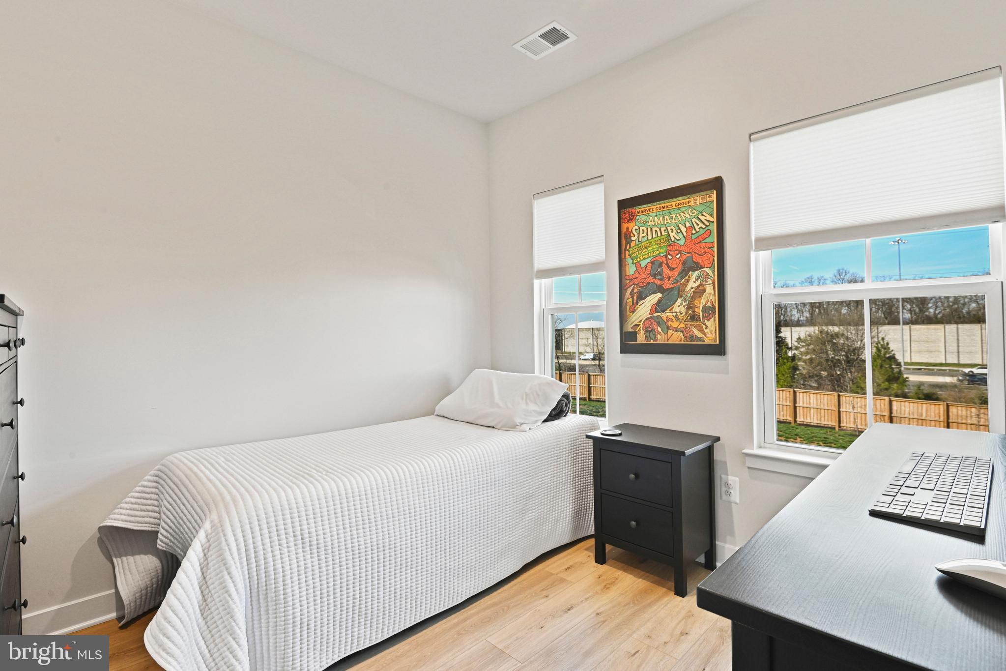 14008 Airfoil Road Herndon, VA 20171 - Photo 29 of 47 a bedroom with a bed and wooden floor