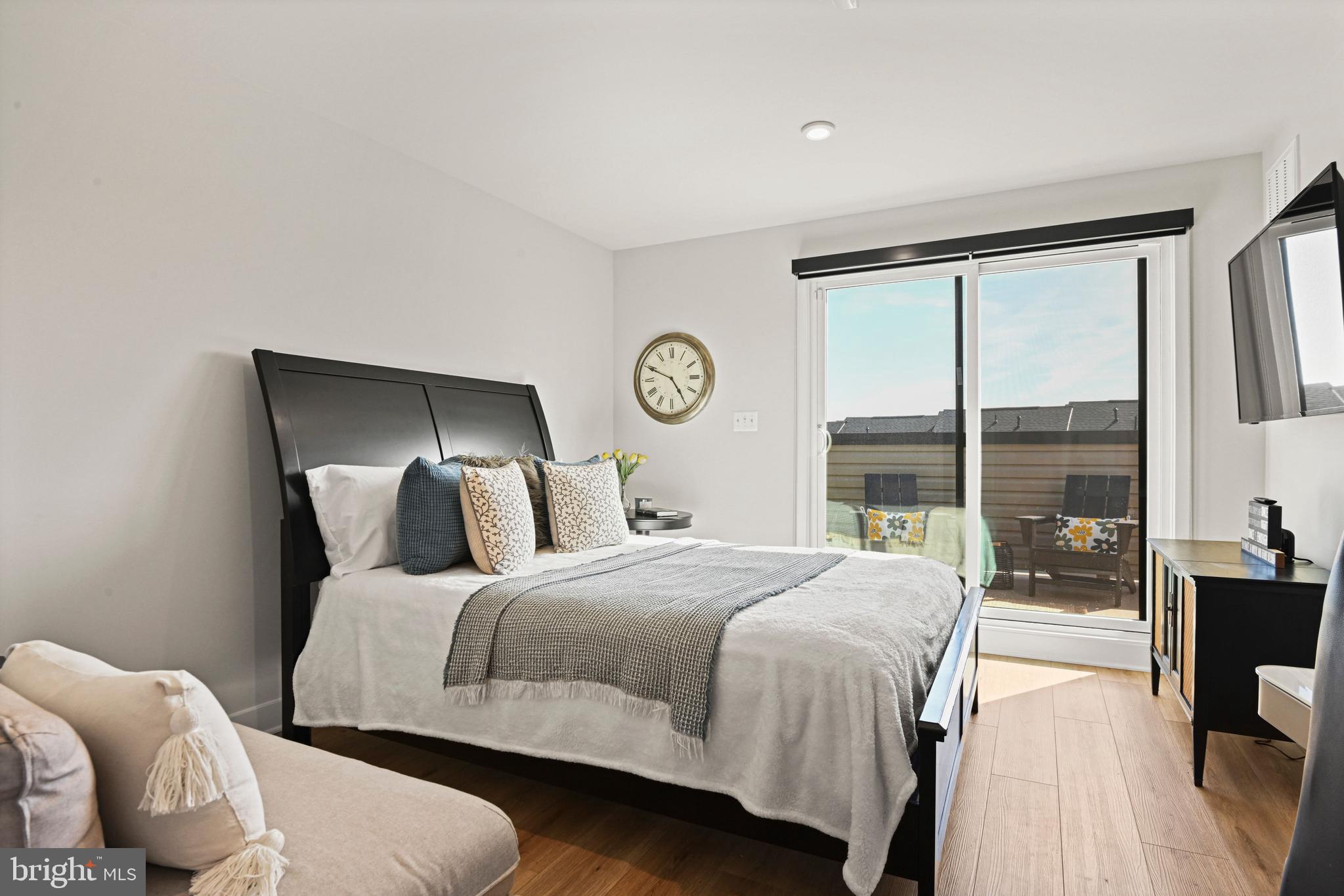 14008 Airfoil Road Herndon, VA 20171 - Photo 36 of 47 a bedroom with a bed and glass window