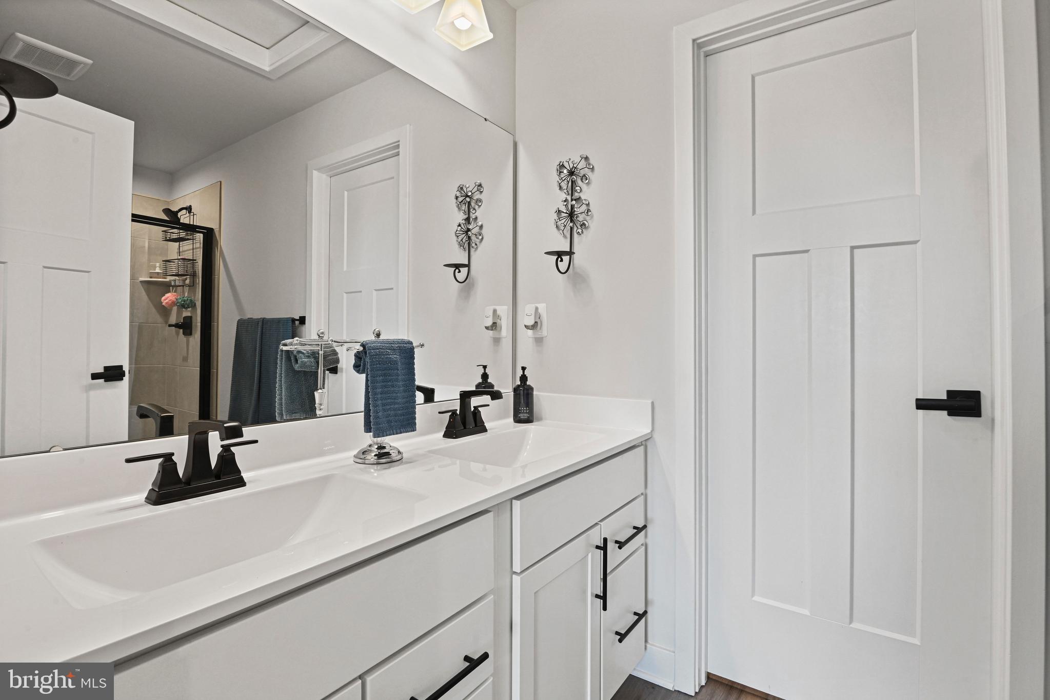 14008 Airfoil Road Herndon, VA 20171 - Photo 37 of 47 a bathroom with a sink and a mirror