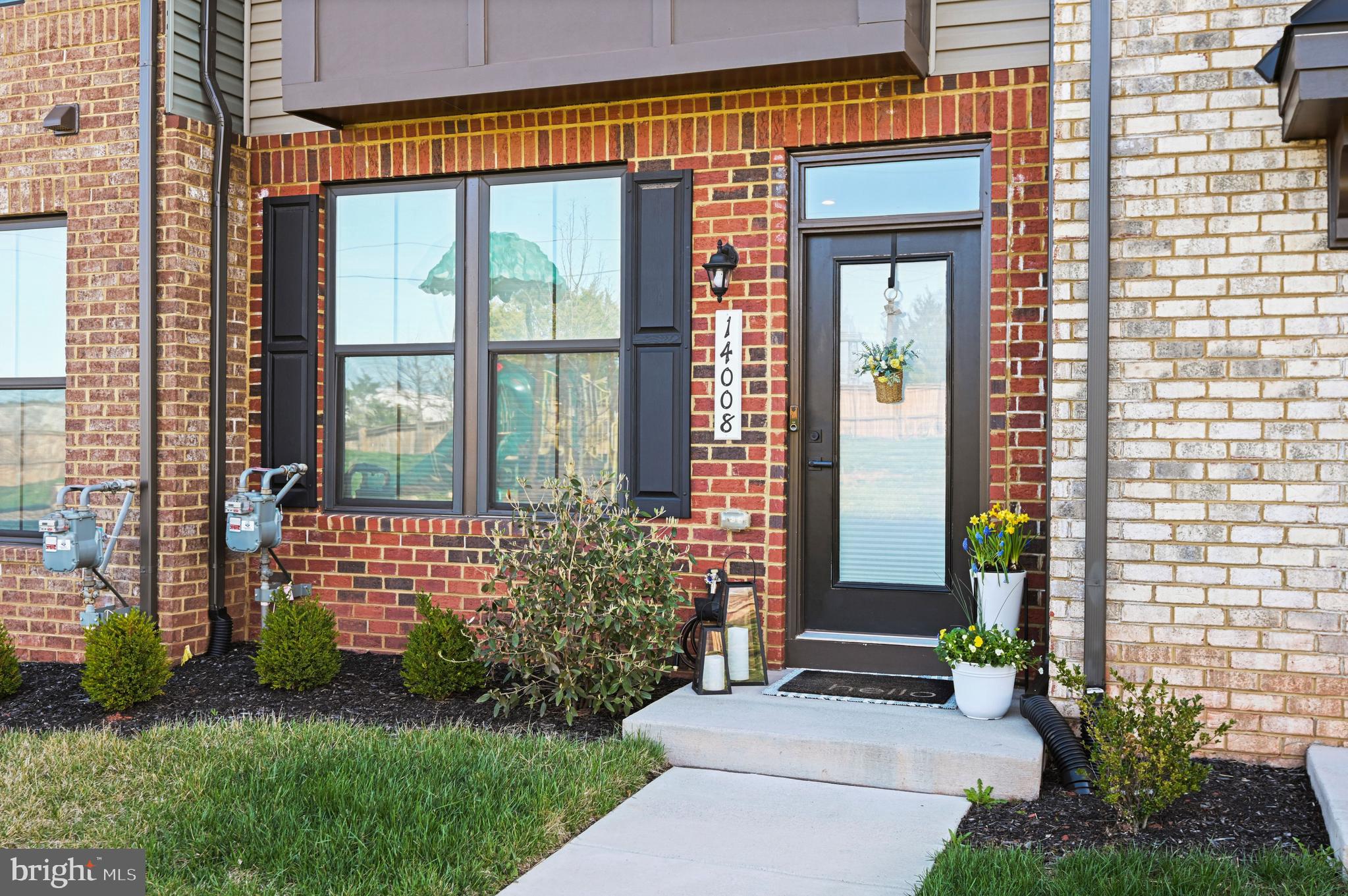 14008 Airfoil Road Herndon, VA 20171 - Photo 5 of 47 a front view of a house with a garden