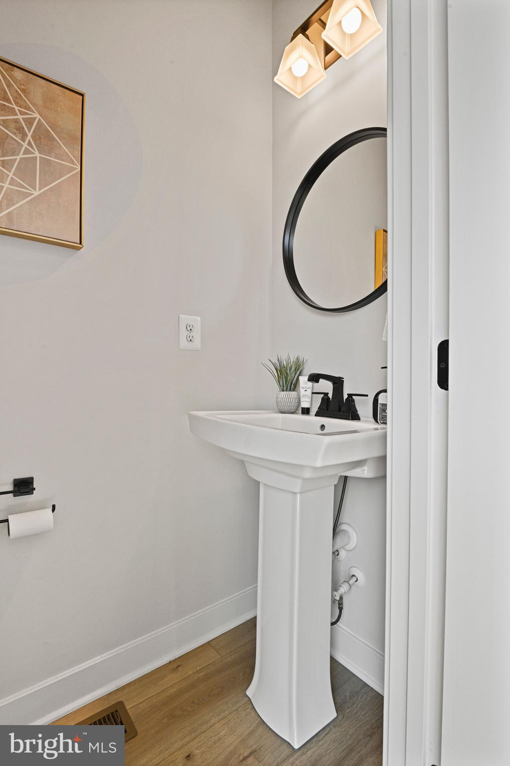 14008 Airfoil Road Herndon, VA 20171 - Photo 9 of 47 a bathroom with a sink and a mirror