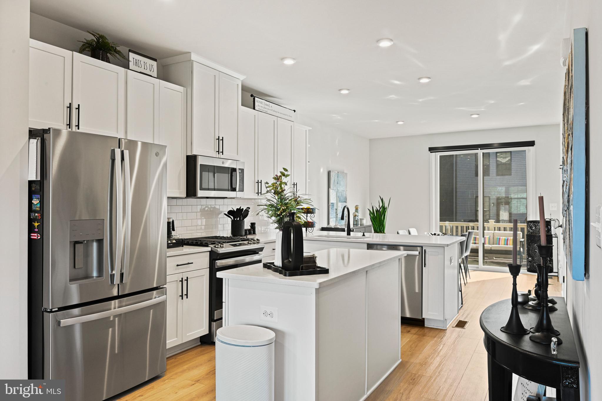 14008 Airfoil Road Herndon, VA 20171 - Photo 47 of 47 a kitchen with white cabinets and stainless steel appliances