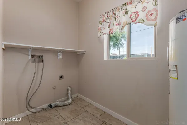 a bathroom with a window and a shower