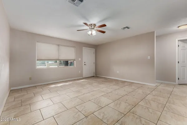 a view of an empty room and window