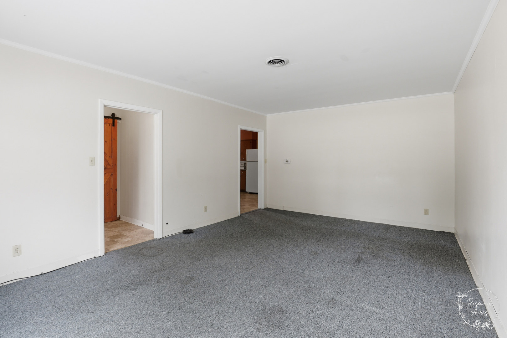409 Main Street Crescent City, IL 60928 - Photo 5 of 22 an empty room with an entryway
