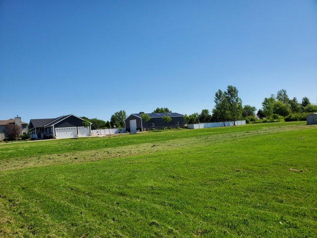 2806 2559th Road Marseilles, IL 61341 - Photo 2 of 3 a view of a green field with wooden fence