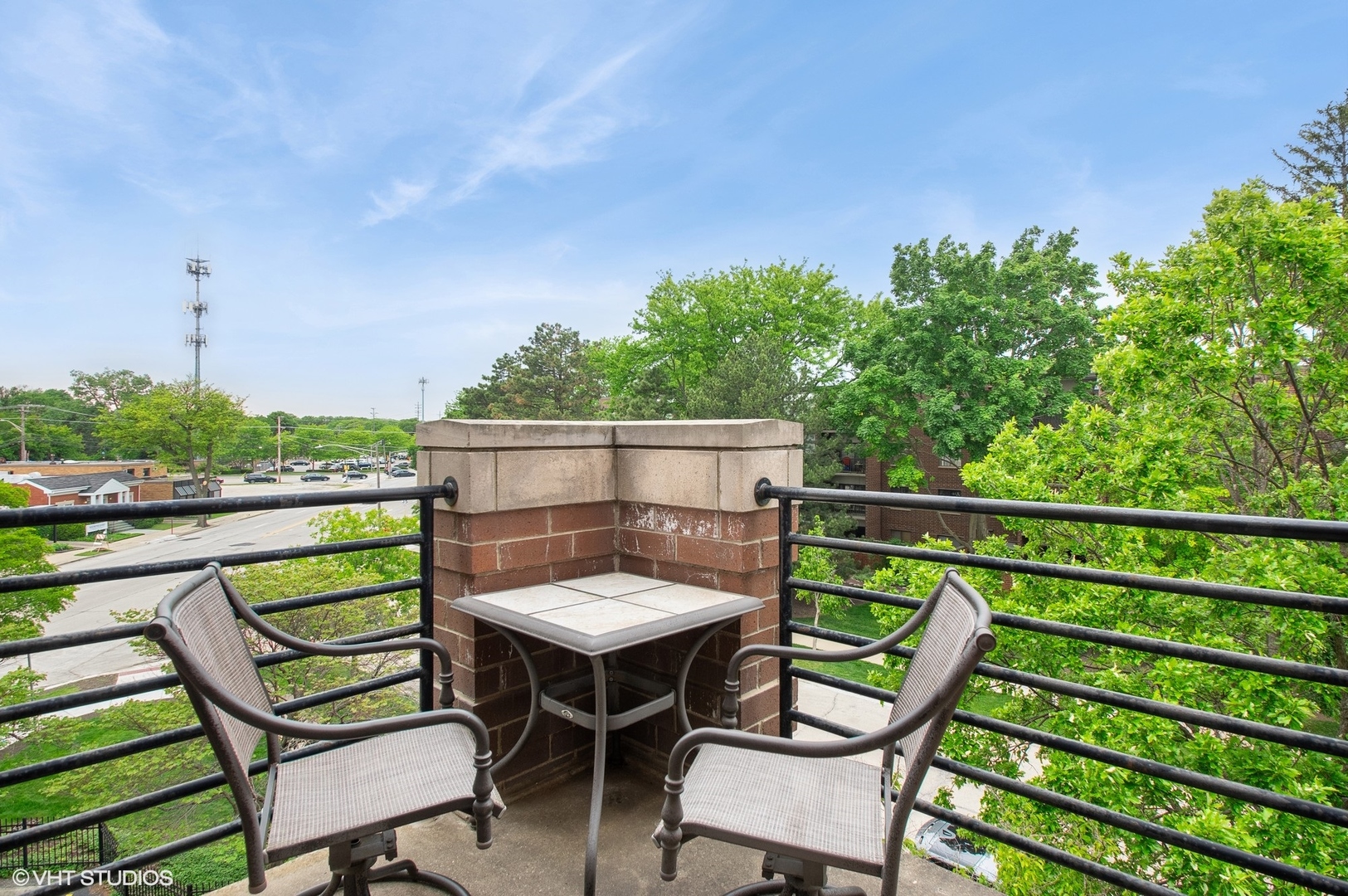 911 Busse Highway, Unit 302 Park Ridge, IL 60068 - Photo 15 of 17 a view of a chairs and table in the outdoor view
