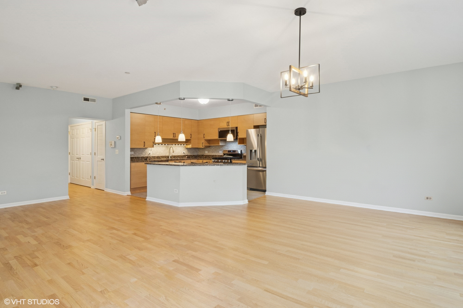 911 Busse Highway, Unit 302 Park Ridge, IL 60068 - Photo 4 of 17 a view of a kitchen with a sink stainless steel appliances and cabinets