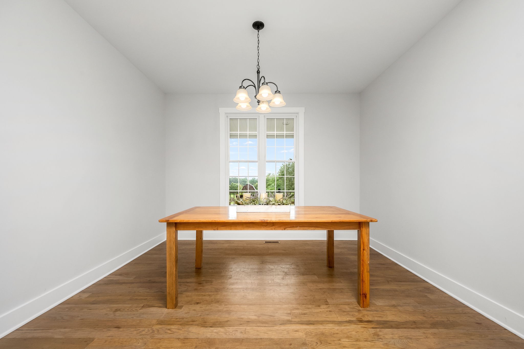 3880 Short Mountain Road Woodbury, TN 37190 - Photo 18 of 56 a view of a room with wooden floor table and chairs