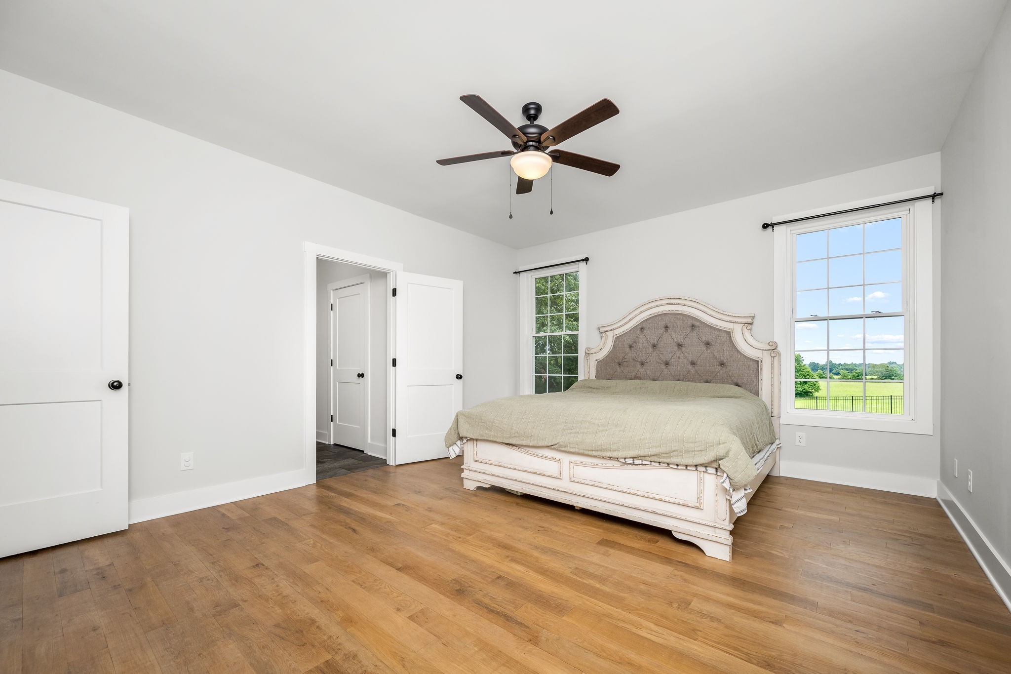 3880 Short Mountain Road Woodbury, TN 37190 - Photo 21 of 56 a spacious bedroom with a bed and a window