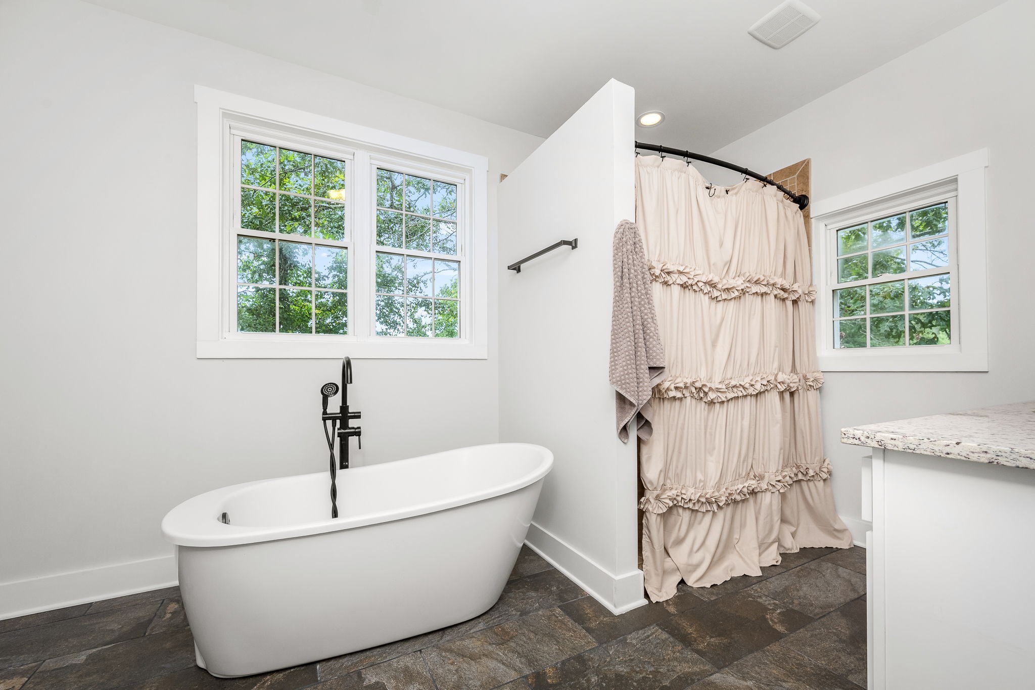 3880 Short Mountain Road Woodbury, TN 37190 - Photo 23 of 56 a bathroom with a bathtub and window