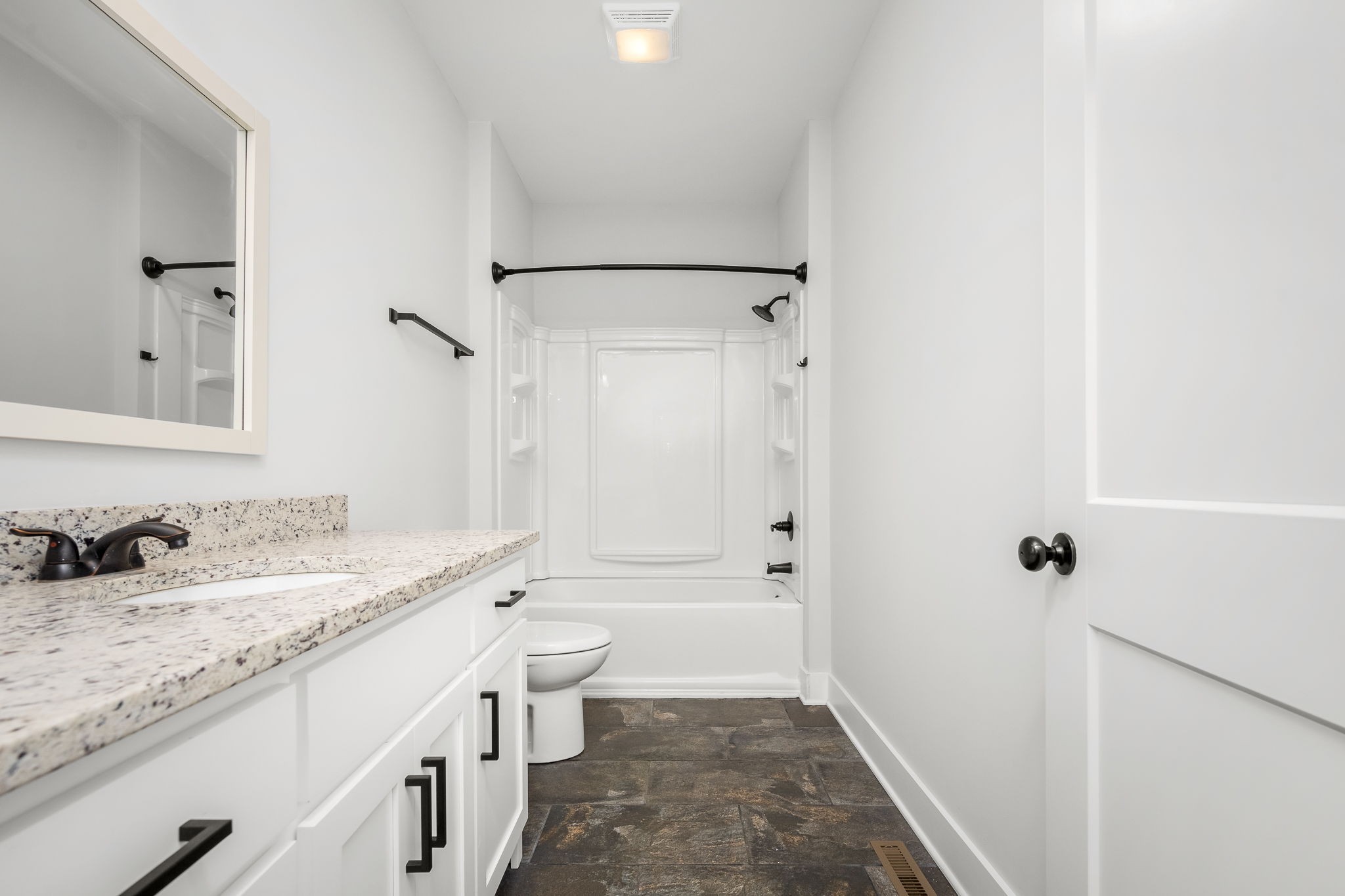 3880 Short Mountain Road Woodbury, TN 37190 - Photo 28 of 56 a bathroom with a granite countertop sink toilet and shower