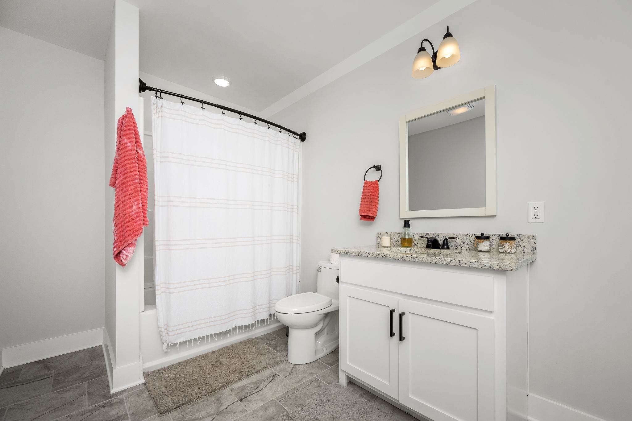 3880 Short Mountain Road Woodbury, TN 37190 - Photo 34 of 56 a bathroom with a granite countertop sink a toilet and a shower