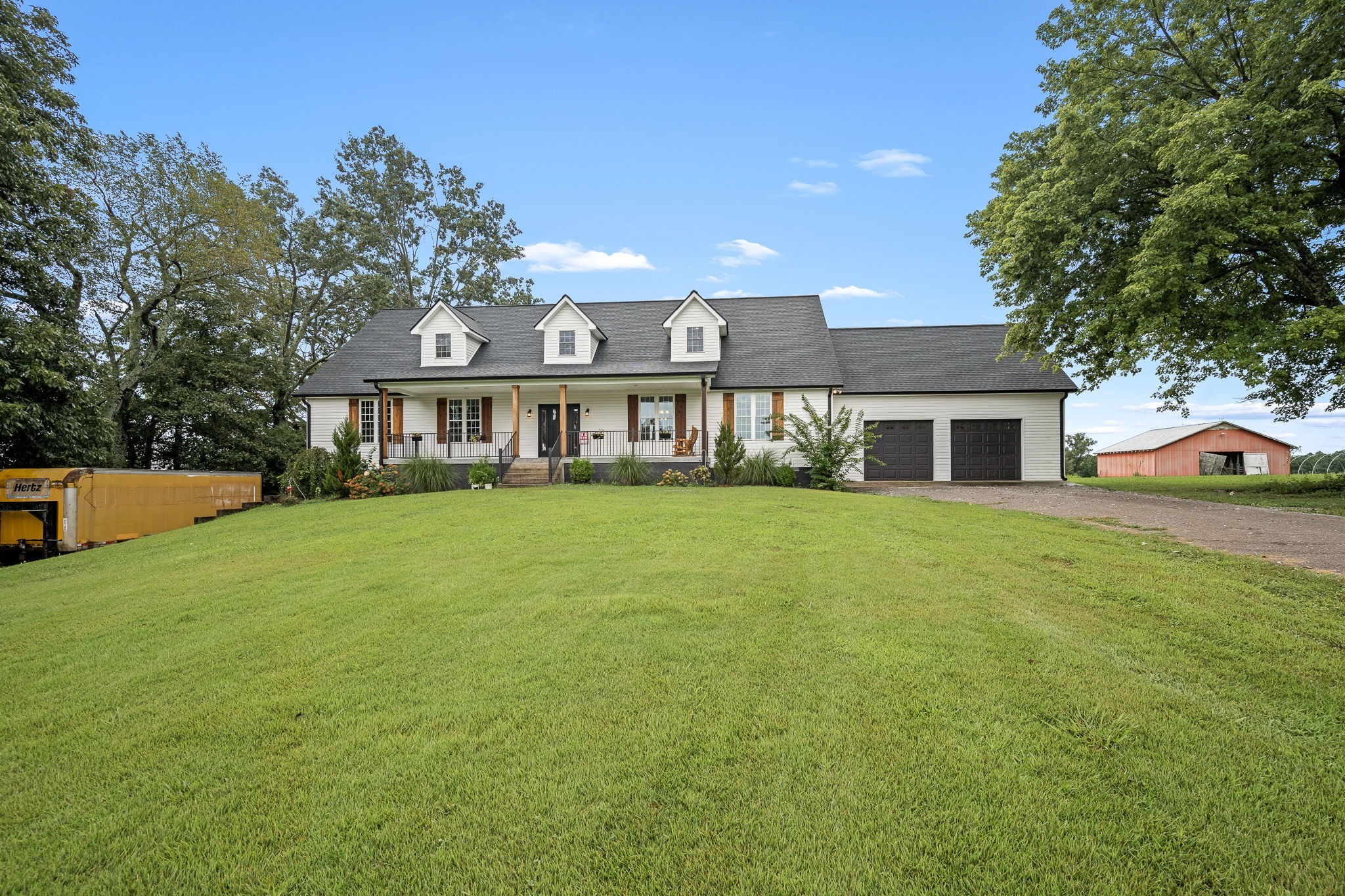 3880 Short Mountain Road Woodbury, TN 37190 - Photo 4 of 56 a front view of a house with yard and green space