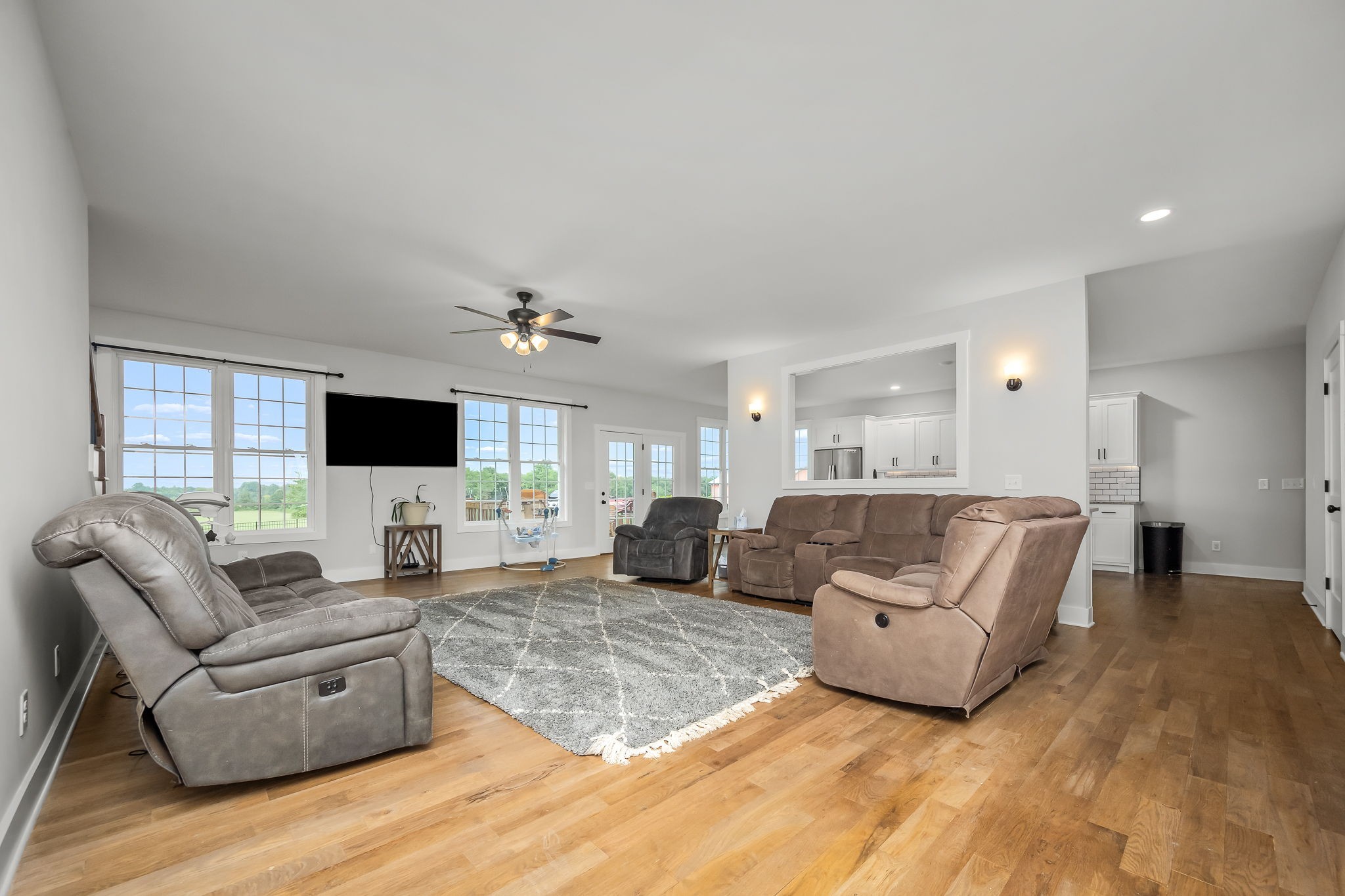 3880 Short Mountain Road Woodbury, TN 37190 - Photo 8 of 56 a living room with furniture a flat screen tv and a large window