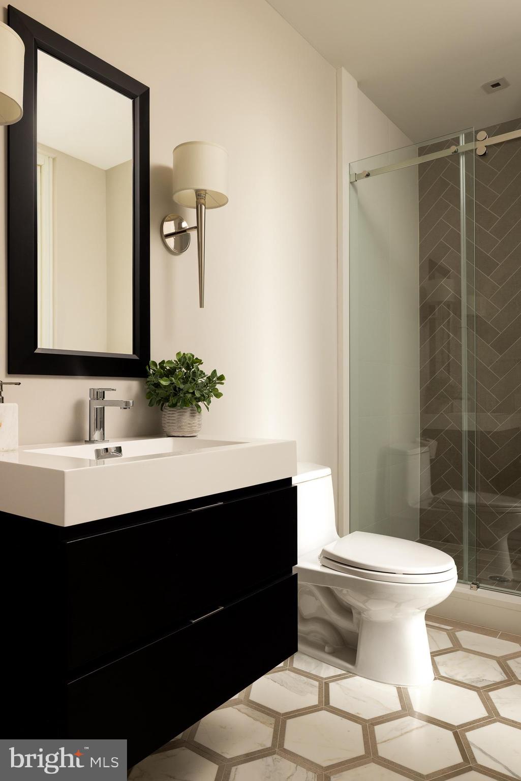 500 Walnut Street, Unit 701 Philadelphia, PA 19106 - Photo 15 of 32 a bathroom with a sink and a mirror