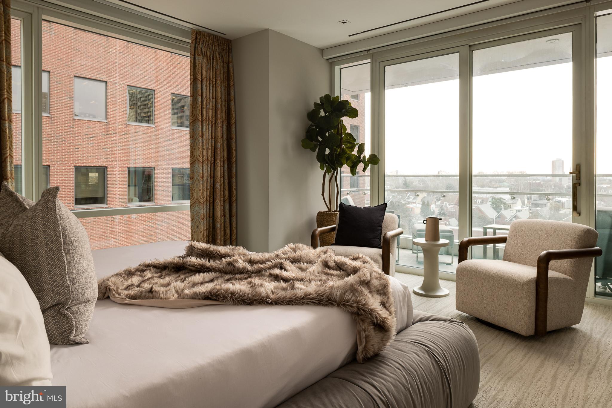 500 Walnut Street, Unit 701 Philadelphia, PA 19106 - Photo 17 of 32 a bedroom with bed and a large window