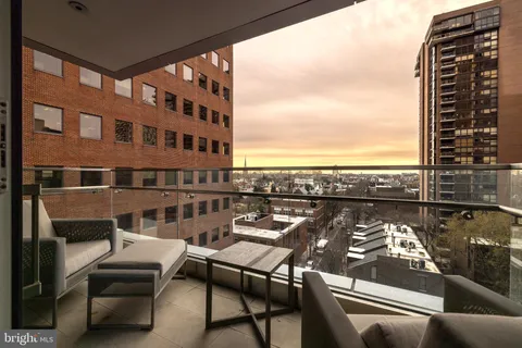 a view of a balcony with chairs