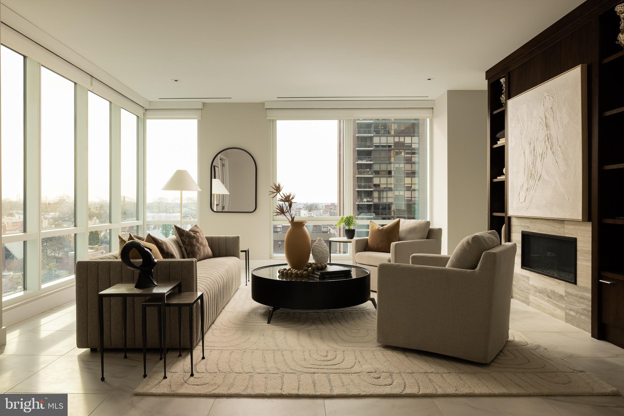 500 Walnut Street, Unit 701 Philadelphia, PA 19106 - Photo 2 of 32 a living room with fireplace furniture and a large window