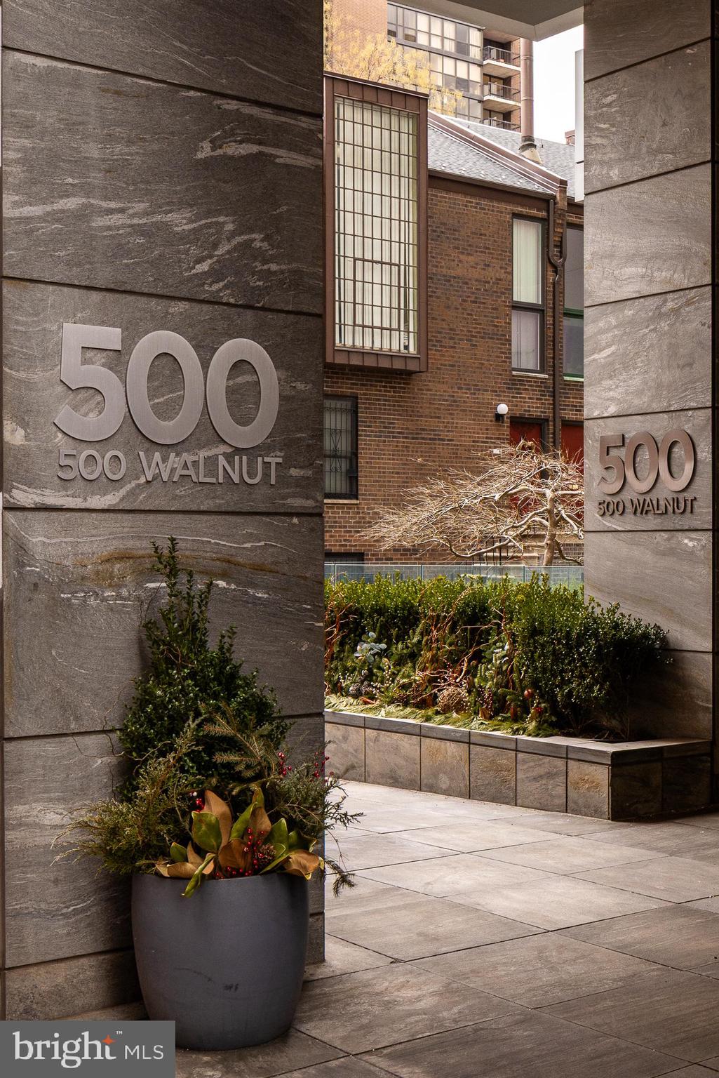 500 Walnut Street, Unit 701 Philadelphia, PA 19106 - Photo 26 of 32 a front view of a house with a potted plant