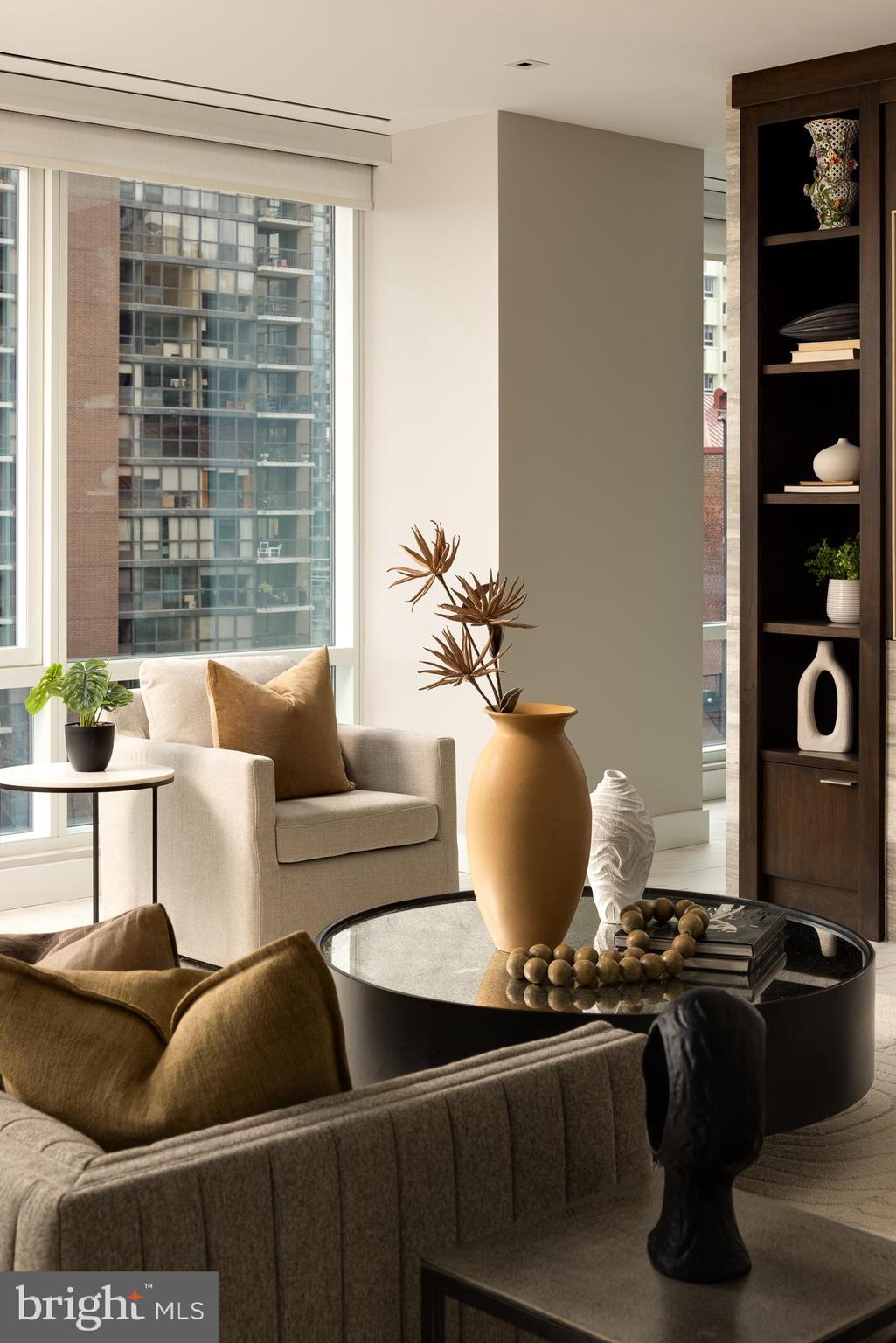 500 Walnut Street, Unit 701 Philadelphia, PA 19106 - Photo 4 of 32 a living room with furniture a rug and a window
