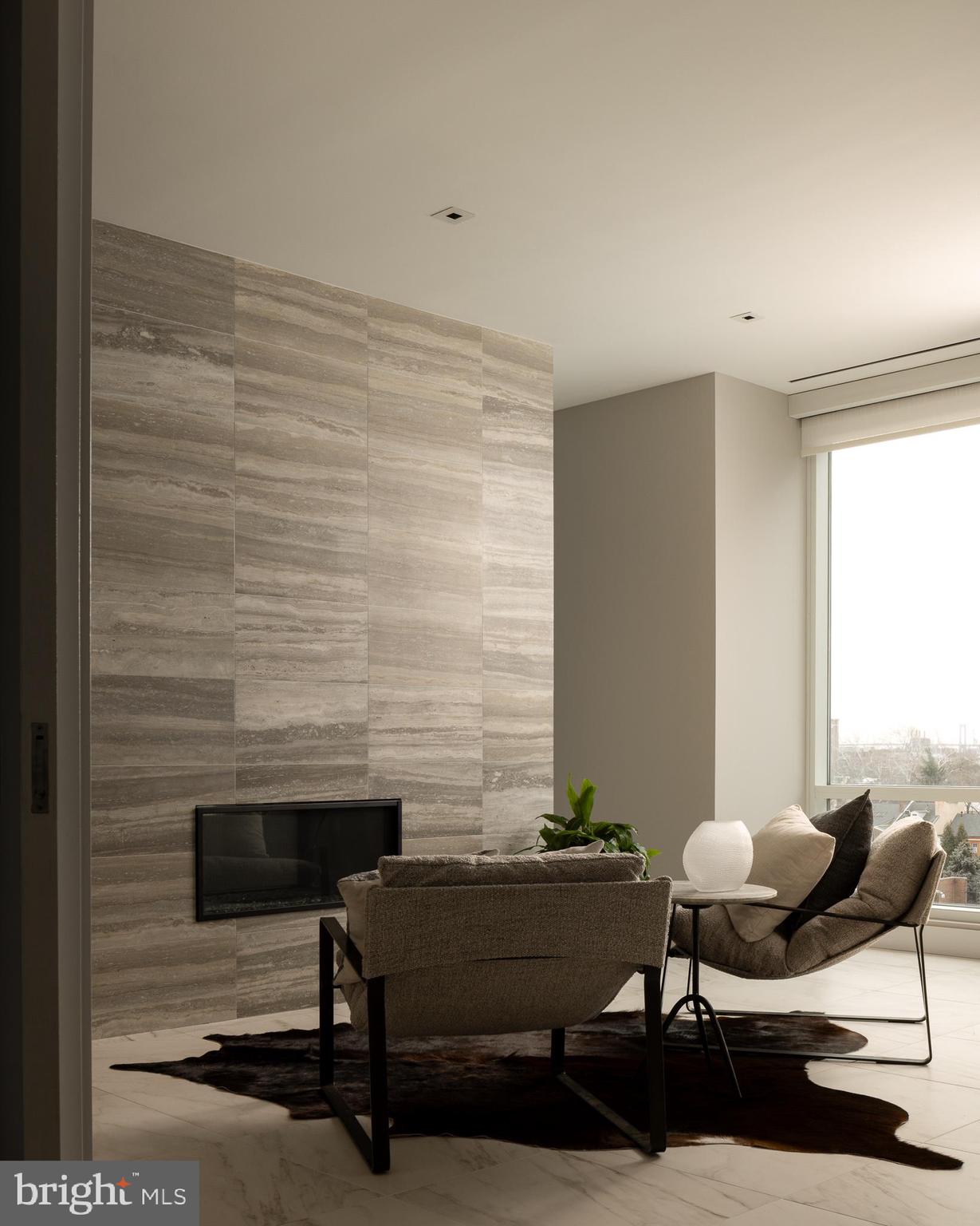 500 Walnut Street, Unit 701 Philadelphia, PA 19106 - Photo 6 of 32 a living room with furniture and a fireplace