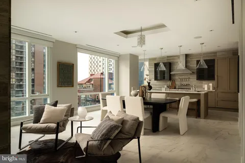 a view of a dining room with furniture and window