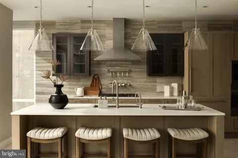 a kitchen with a table and chairs in it