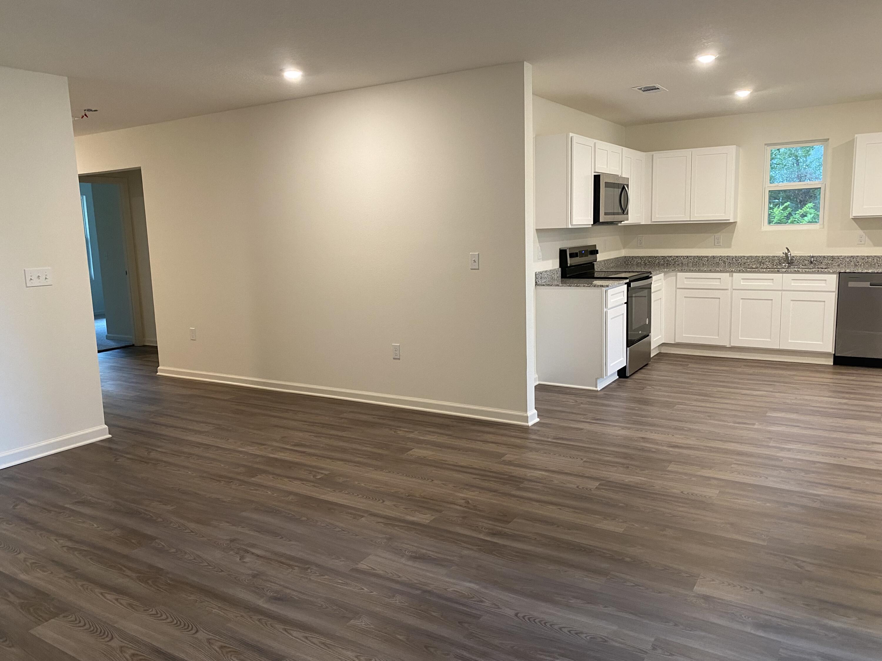 128 Squirrel Road DeFuniak Springs, FL 32433 - Photo 8 of 12 a view of kitchen with wooden floor