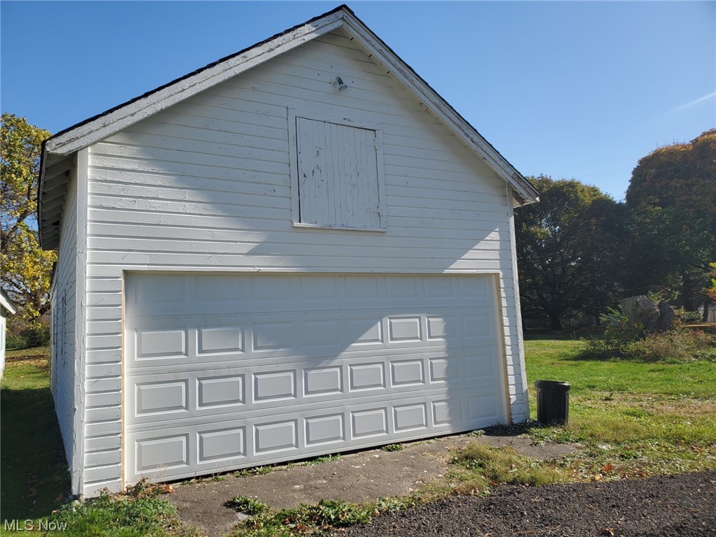 4589 Lane Road Perry, OH 44081 - Photo 3 of 25 2 CAR GARAGE IN FRONT. NEW GARAGE DOOR. BARN AND STORAGE AREA ATTACHED
