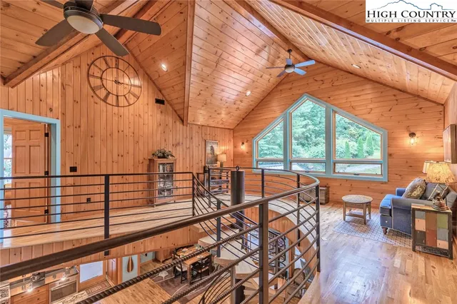 a view of a living room and balcony