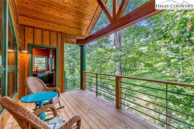 a view of balcony with furniture and wooden deck