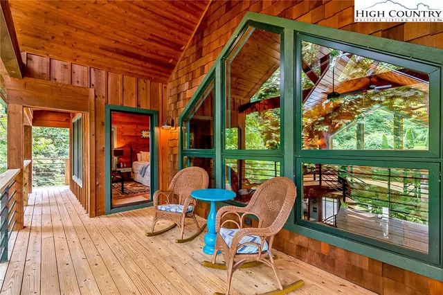 a outdoor space with wooden floor and furniture