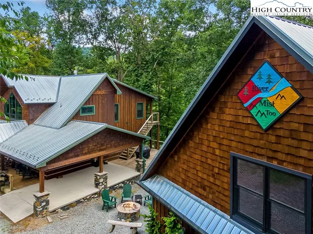 an aerial view of houses with deck and outdoor space