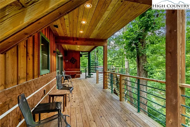 a view of a chairs and table in the balcony
