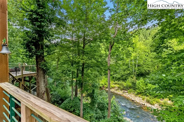 a view of a garden from a balcony