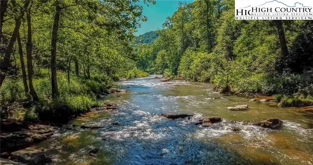 a view of a street with lots of trees