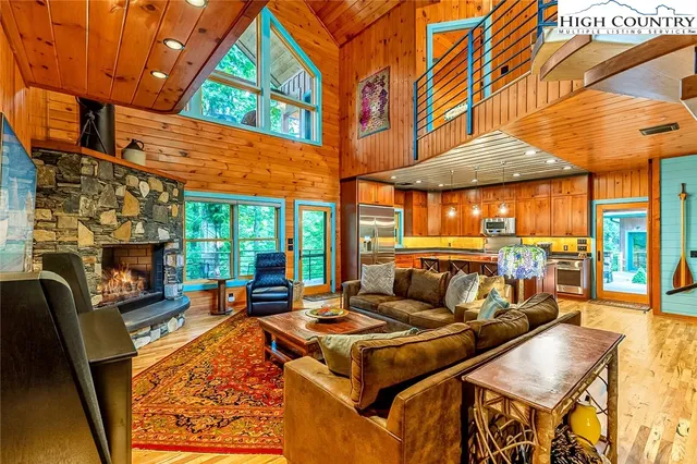 a living room filled with furniture and a fireplace