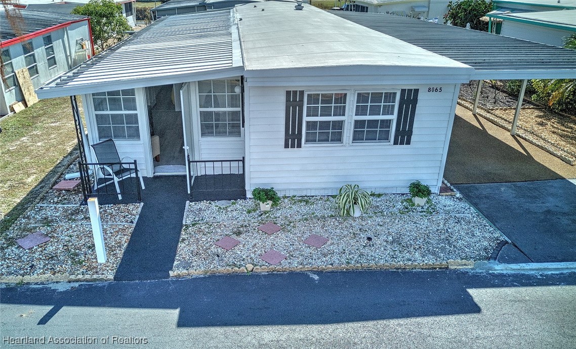 8065 Von Maxcy Road Sebring, FL 33870 - Photo 1 of 37 Front Porch and Front Entrance. Long covered carport. Turnkey Home-move right in!