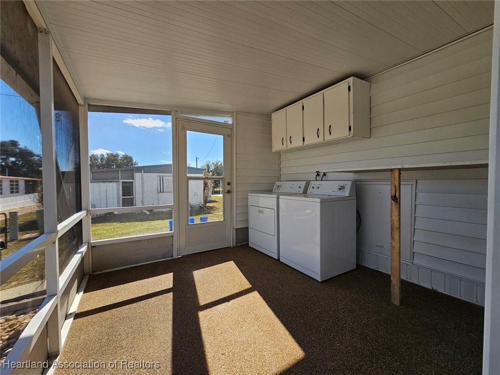 8065 Von Maxcy Road Sebring, FL 33870 - Photo 24 of 37 Large Laundry area with folding table plus rear porch.