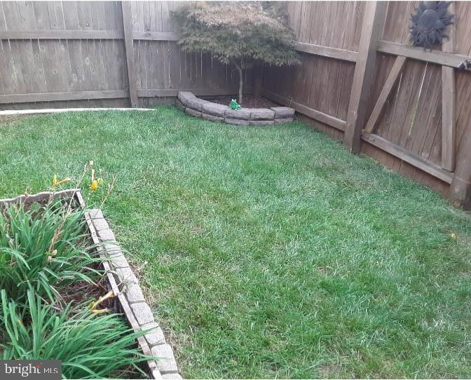 660 Hunting Fields Road Middle River, MD 21220 - Photo 31 of 38 Serene backyard oasis with lush greenery.