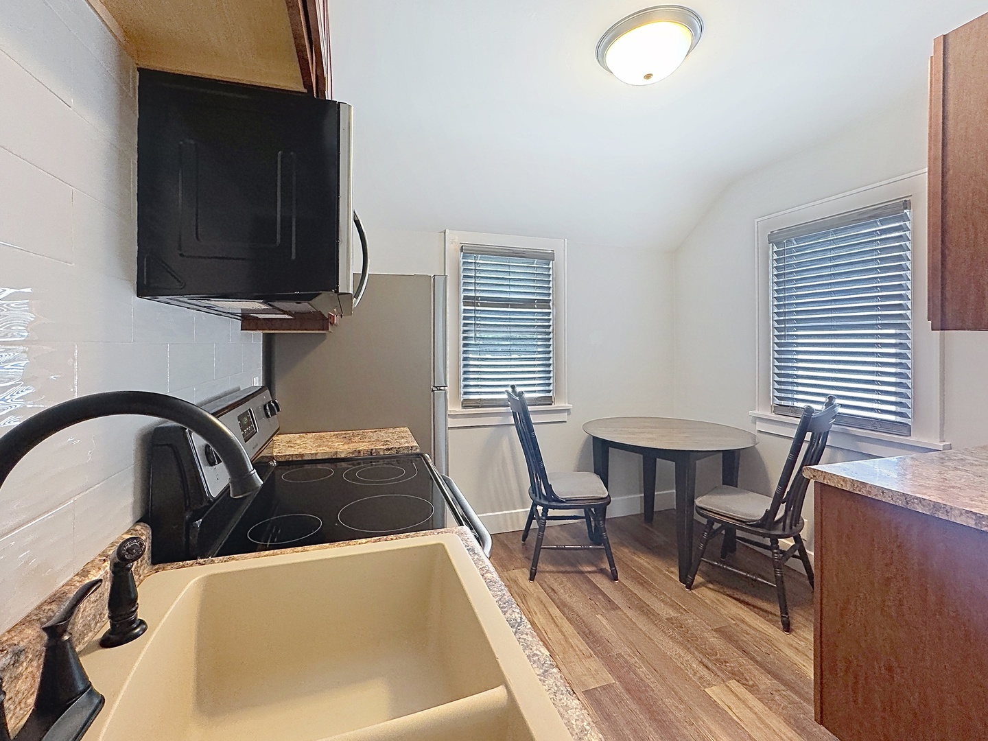 1841 32nd Street Moline, IL 61265 - Photo 6 of 24 a room with a chair and a table