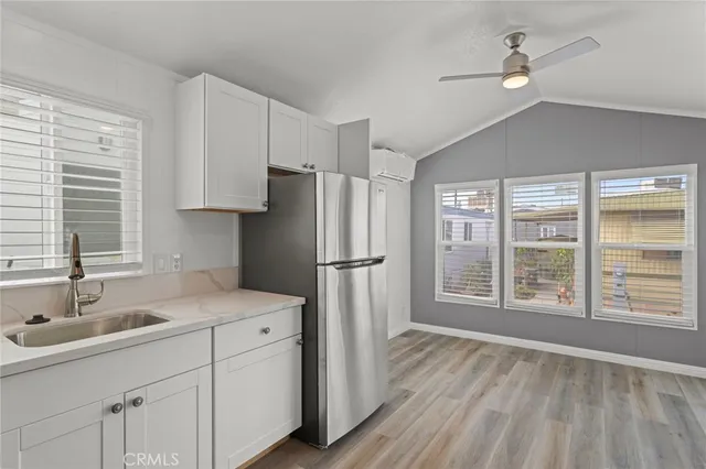 a kitchen with stainless steel appliances a sink stove and refrigerator