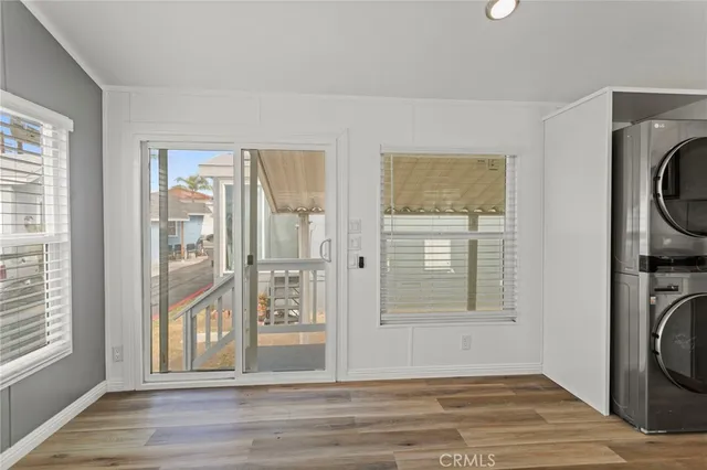 a view of a door with wooden floor and a window