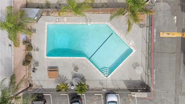 an aerial view of a house with a palm tree