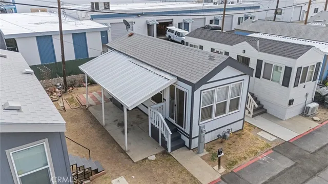a view of a house with wooden deck
