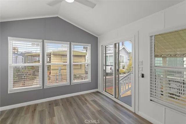 a view of an empty room with glass door