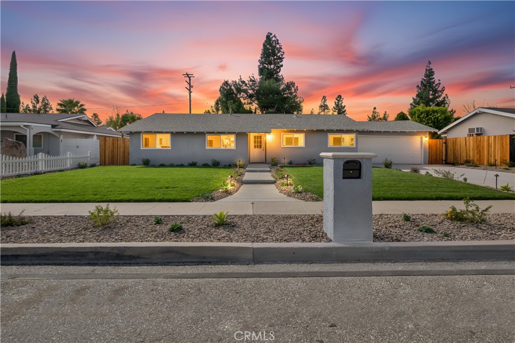 1791 Sitka Avenue Simi Valley, CA 93063 - Photo 2 of 44 a front view of a house with a yard and a garage
